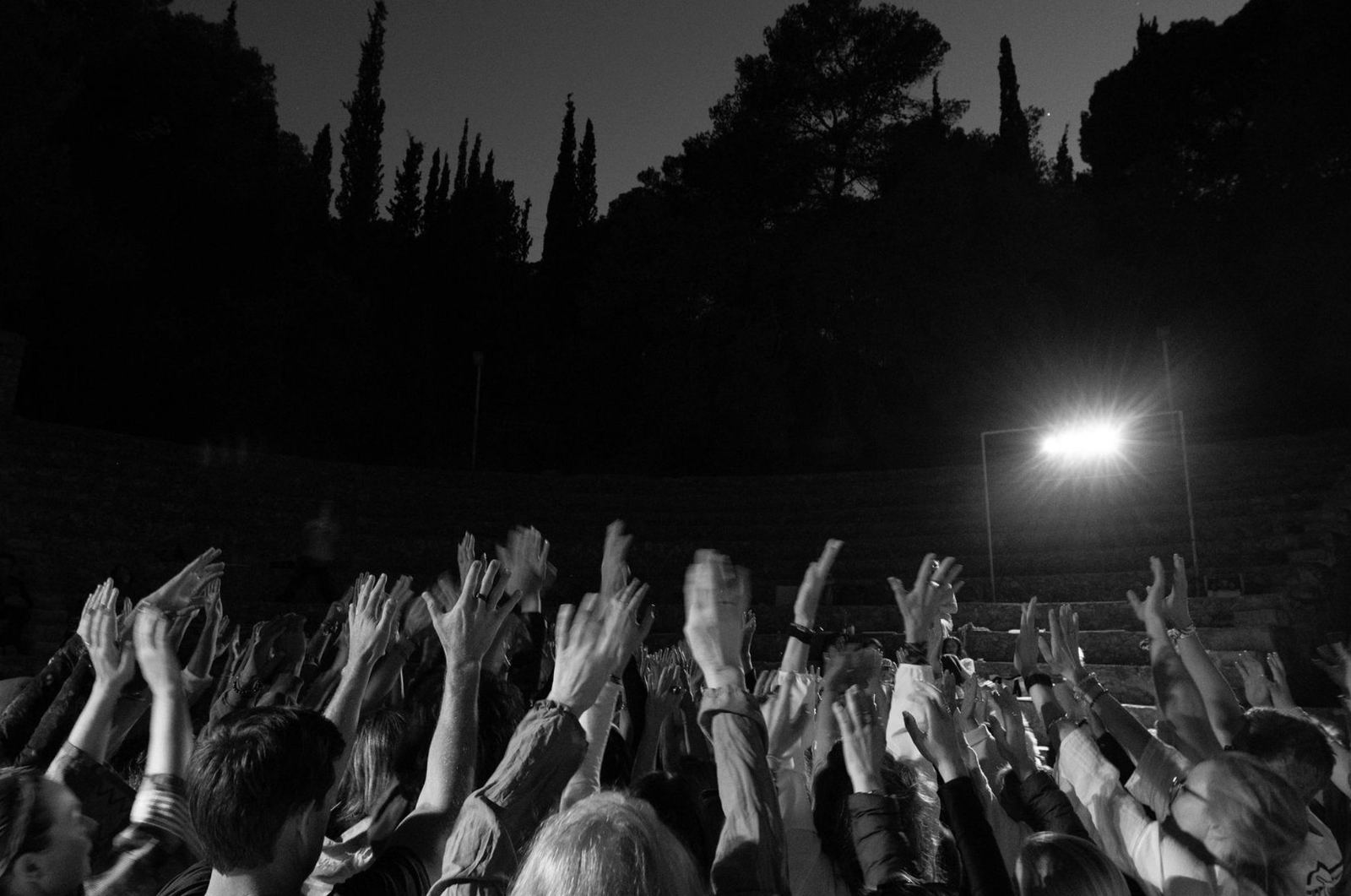 Hands to the night sky — the amphitheatre in full voice